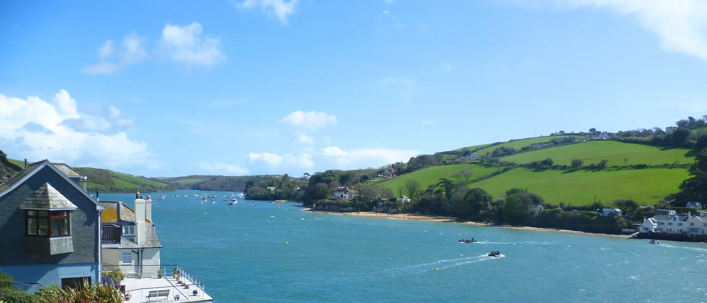 The Kingsbridge Estuary at Salcombe, with wooded slopes above the water and boats on their moorings